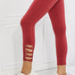 Yelete Ready For Action Full Size Ankle Cutout Active Leggings in Brick Red