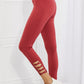 Yelete Ready For Action Full Size Ankle Cutout Active Leggings in Brick Red